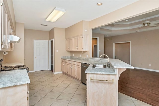 kitchen featuring exhaust hood, white range, sink, light hardwood / wood-style flooring, and stainless steel dishwasher