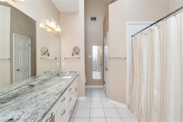 bathroom with tile patterned floors and vanity