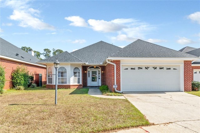 single story home with a garage and a front lawn