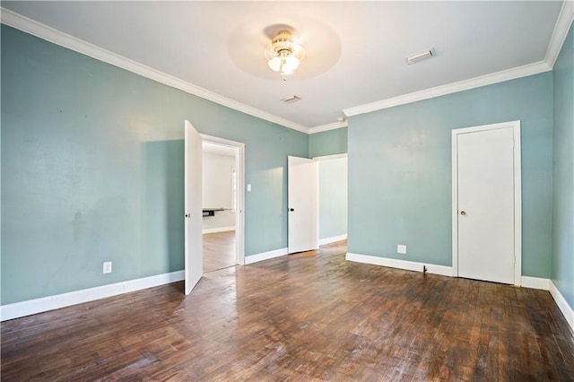 unfurnished bedroom with dark hardwood / wood-style flooring, ornamental molding, and ceiling fan