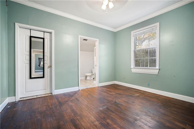 unfurnished bedroom with ensuite bathroom, hardwood / wood-style flooring, ornamental molding, ceiling fan, and a closet