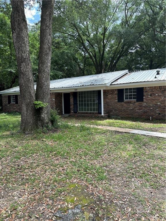 315 Thunderbird Dr, Satsuma, AL 36572 - ranch-style house with metal roof and brick siding