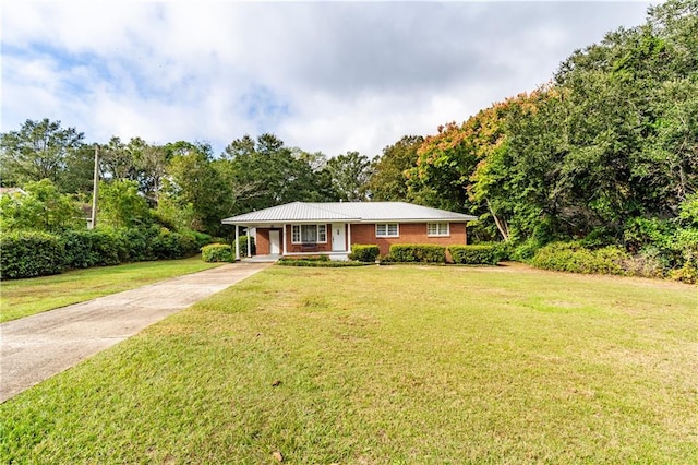 view of front of house featuring a front yard and covered porch