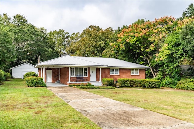 ranch-style home with covered porch and a front lawn