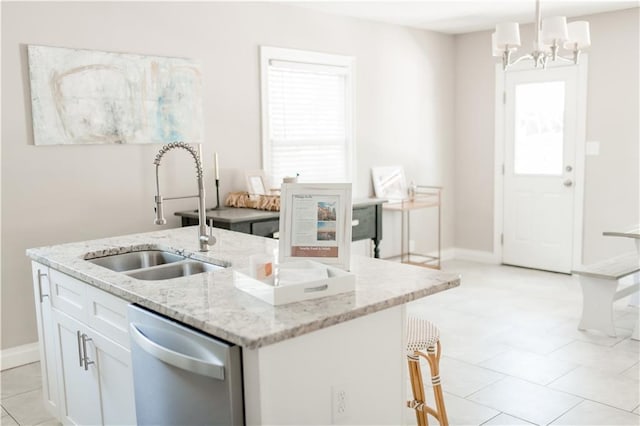 1660 Old Shell Rd, Mobile, AL 36604 - kitchen featuring dishwasher, a center island with sink, white cabinetry, light stone countertops, and hanging light fixtures