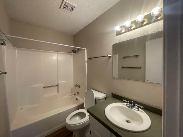 bathroom featuring visible vents, toilet, shower / tub combination, a textured ceiling, and vanity