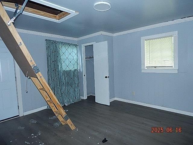 1021 Cherry St, Mobile, AL 36610 - unfurnished bedroom with crown molding, wood finished floors, and a closet