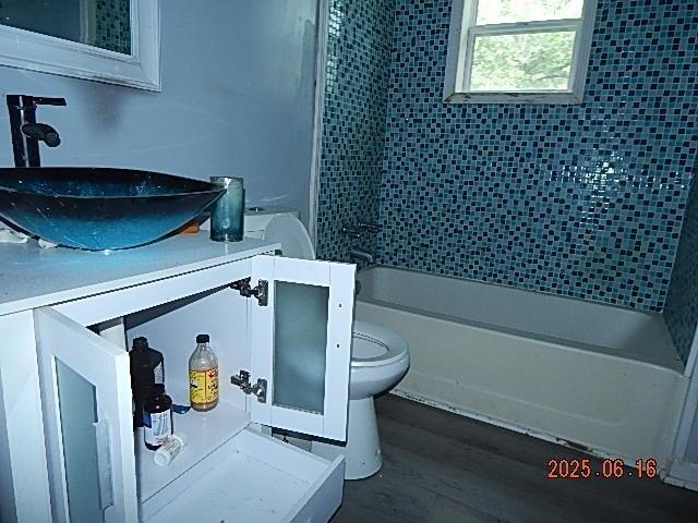 1021 Cherry St, Mobile, AL 36610 - full bath with vanity, bathing tub / shower combination, and wood finished floors