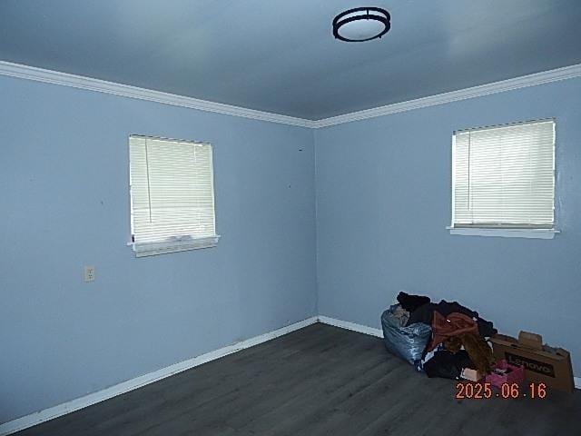 1021 Cherry St, Mobile, AL 36610 - spare room with crown molding and dark wood-style flooring