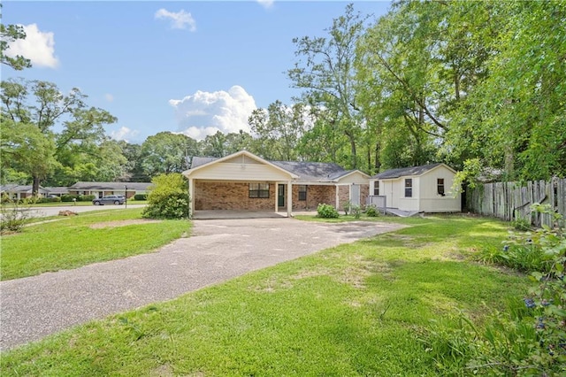 5902 Reams Dr S, Mobile, AL 36608 - ranch-style home featuring asphalt driveway, a carport, and brick siding