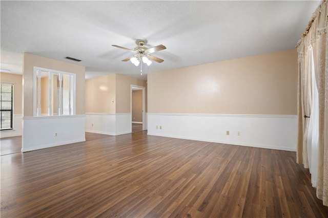 5902 Reams Dr S, Mobile, AL 36608 - empty room featuring ceiling fan, dark wood-style floors, and a textured ceiling