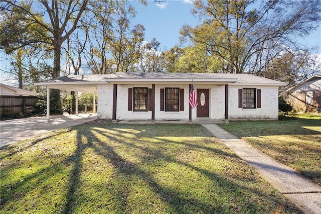 single story home featuring a carport, covered porch, and a front yard