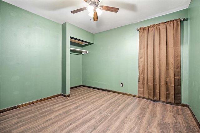 unfurnished room featuring wood-type flooring and ceiling fan