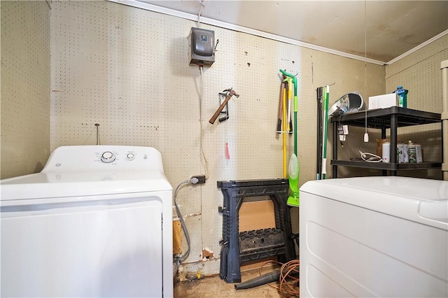 laundry room with washer / clothes dryer and crown molding