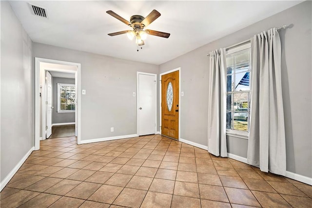 interior space featuring ceiling fan and light tile patterned flooring