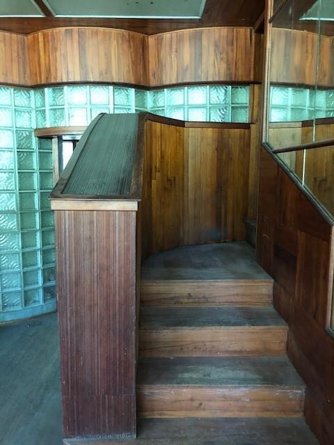 stairway with wood walls