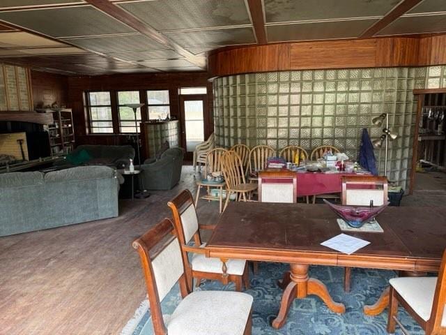 dining room featuring wooden walls