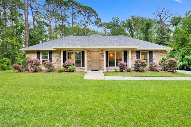 ranch-style home with a front yard