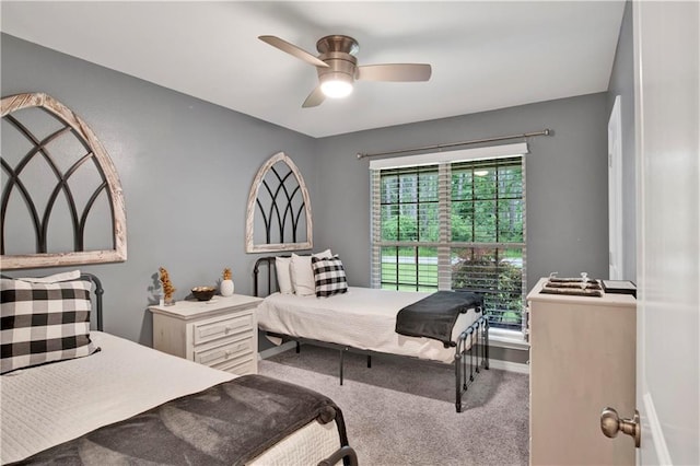 bedroom with light colored carpet and ceiling fan