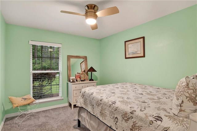 bedroom with ceiling fan and light colored carpet