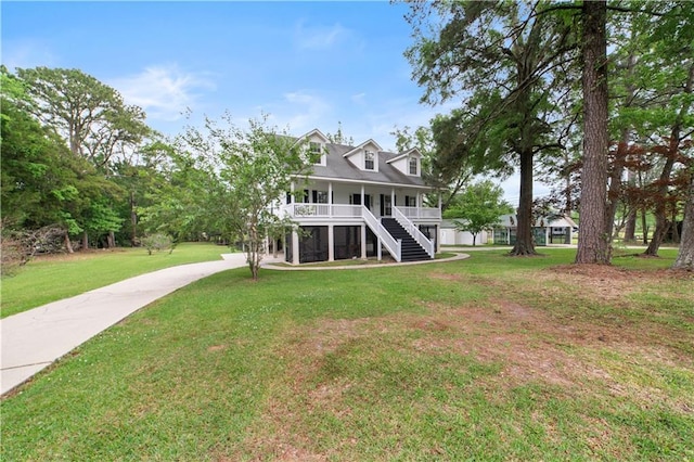 5039 Cole Dr W, Mobile, AL 36619 - back of house with covered porch, a yard, concrete driveway, and stairs
