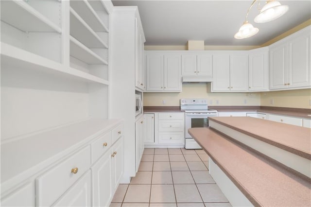 5039 Cole Dr W, Mobile, AL 36619 - kitchen with electric stove, white cabinetry, light tile patterned floors, and under cabinet range hood