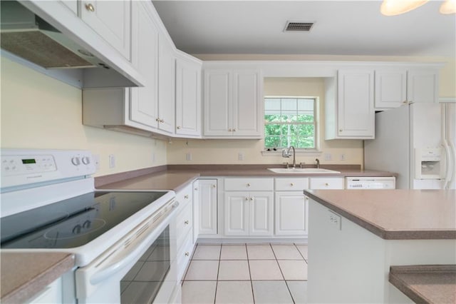 5039 Cole Dr W, Mobile, AL 36619 - kitchen featuring white cabinets, a sink, white appliances, under cabinet range hood, and visible vents