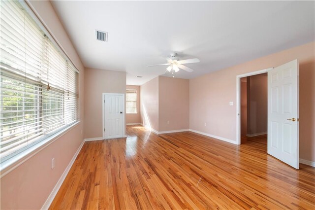 5039 Cole Dr W, Mobile, AL 36619 - empty room with ceiling fan, visible vents, baseboards, and light wood finished floors