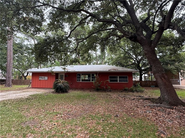 408 Chenault Ave, Dauphin Island, AL 36528 - single story home with a metal roof and driveway