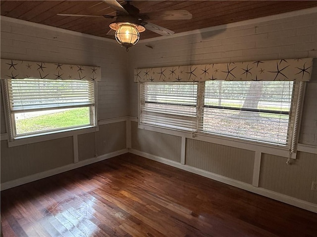 408 Chenault Ave, Dauphin Island, AL 36528 - spare room with wood finished floors, healthy amount of natural light, a ceiling fan, wooden ceiling, and wood walls