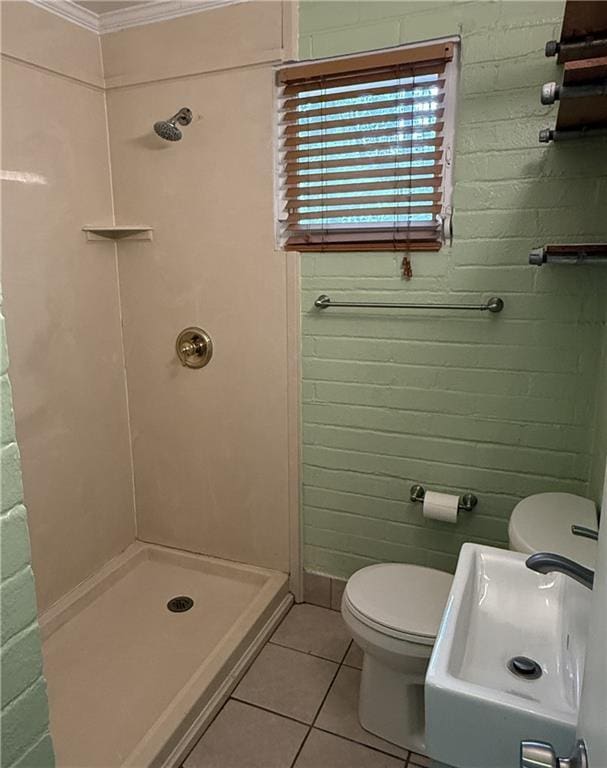 408 Chenault Ave, Dauphin Island, AL 36528 - full bathroom with tile patterned flooring, a shower stall, and crown molding