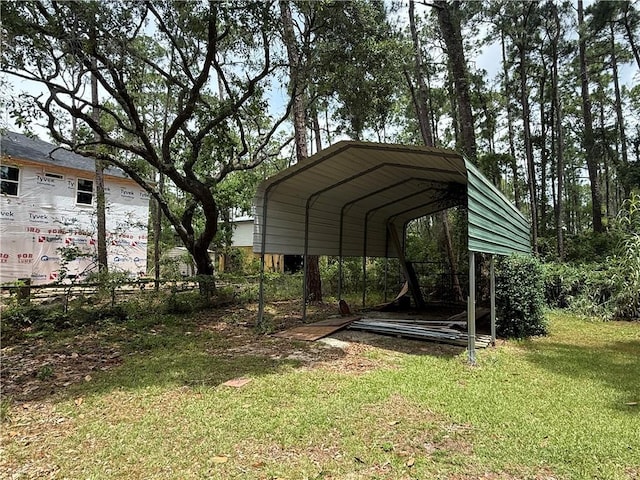 408 Chenault Ave, Dauphin Island, AL 36528 - view of green lawn featuring a detached carport