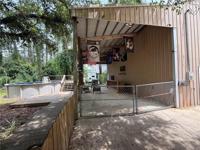 408 Chenault Ave, Dauphin Island, AL 36528 - view of patio / terrace featuring a gate and an outdoor pool