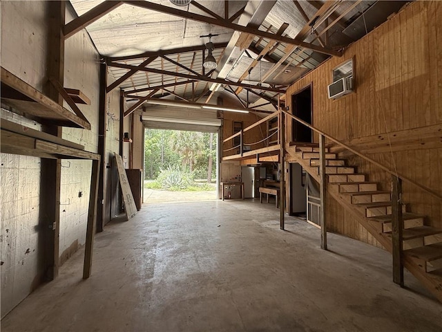 408 Chenault Ave, Dauphin Island, AL 36528 - garage featuring an AC wall unit and wood walls