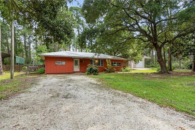 408 Chenault Ave, Dauphin Island, AL 36528 - ranch-style house with gravel driveway and a metal roof