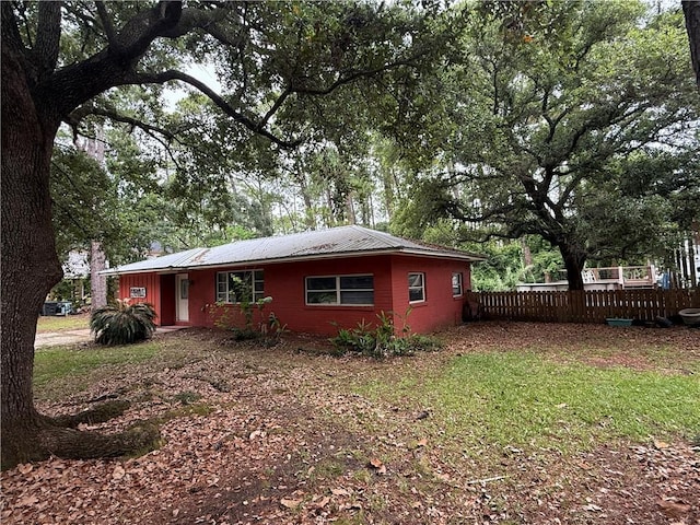 408 Chenault Ave, Dauphin Island, AL 36528 - view of side of property with a metal roof