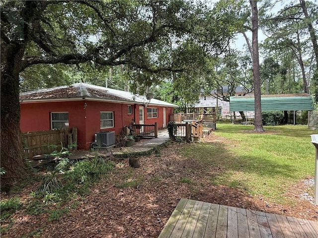 408 Chenault Ave, Dauphin Island, AL 36528 - view of grassy yard with a wooden deck