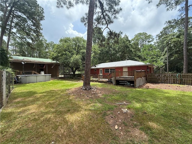 408 Chenault Ave, Dauphin Island, AL 36528 - fenced backyard with a wooden deck