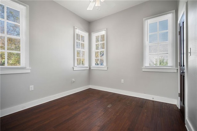 spare room with wood-type flooring and ceiling fan