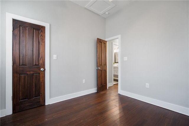 unfurnished bedroom featuring dark hardwood / wood-style floors