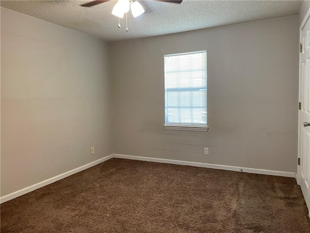 carpeted empty room featuring ceiling fan and a textured ceiling