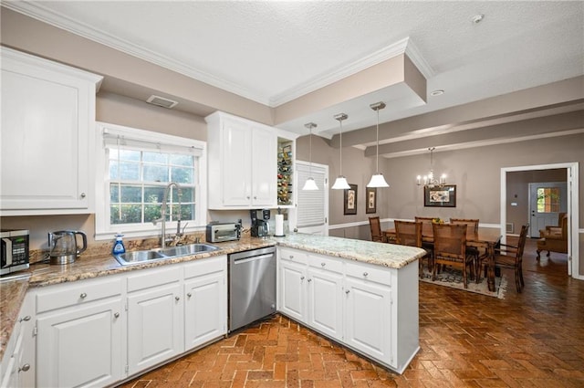 kitchen featuring kitchen peninsula, hanging light fixtures, appliances with stainless steel finishes, white cabinetry, and sink