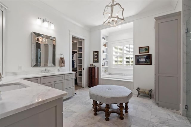 bathroom with shower with separate bathtub, a chandelier, ornamental molding, vanity, and built in features