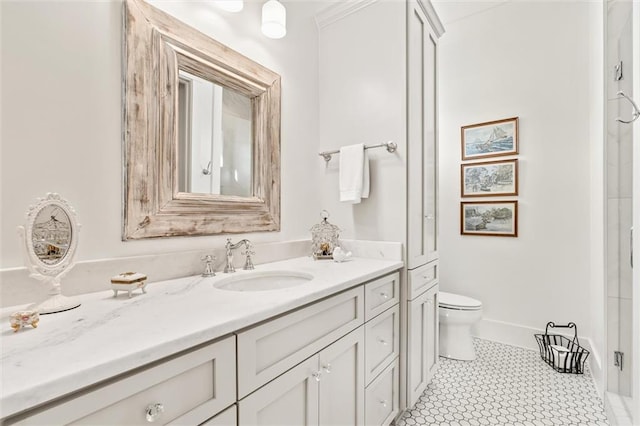 bathroom featuring tile patterned flooring, vanity, and toilet