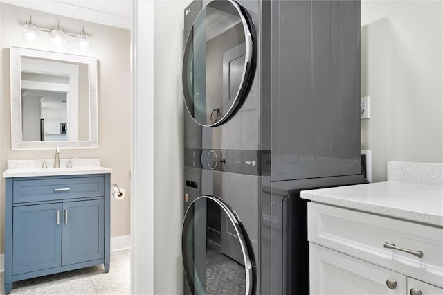 109 Quebec Ct, Dauphin Island, AL 36528 - laundry room featuring stacked washing machine and dryer and baseboards