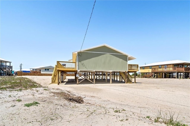 109 Quebec Ct, Dauphin Island, AL 36528 - view of outbuilding with stairway and a carport