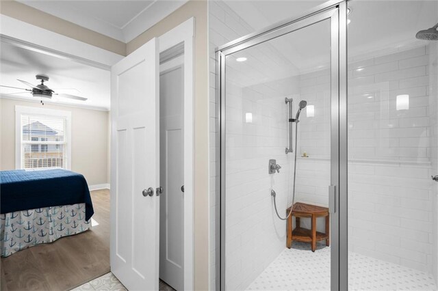 109 Quebec Ct, Dauphin Island, AL 36528 - ensuite bathroom with a shower stall, ceiling fan, and wood finished floors