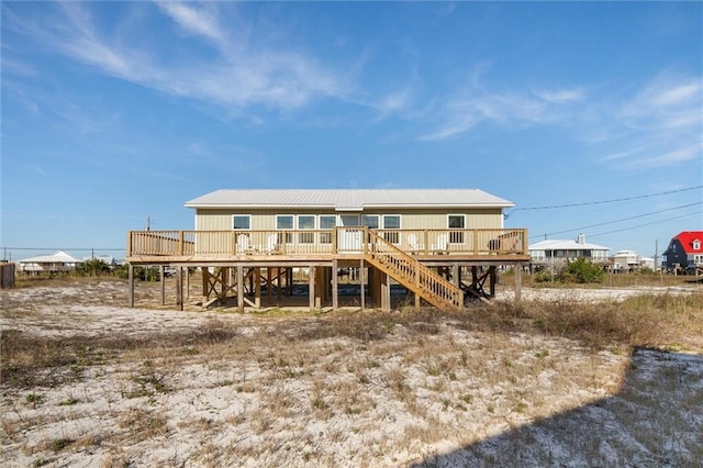 109 Quebec Ct, Dauphin Island, AL 36528 - back of property featuring a deck, stairway, and metal roof