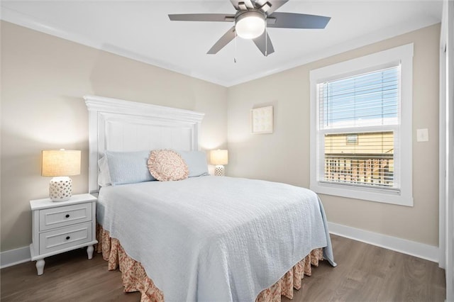 109 Quebec Ct, Dauphin Island, AL 36528 - bedroom featuring dark wood finished floors, baseboards, and a ceiling fan