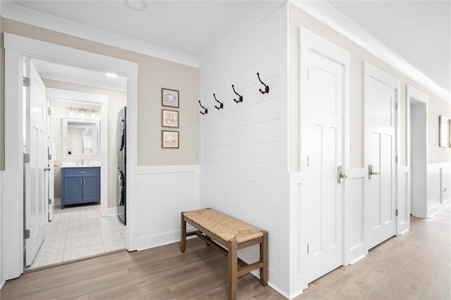 109 Quebec Ct, Dauphin Island, AL 36528 - mudroom featuring light wood-type flooring and crown molding
